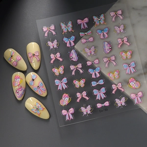 Pegatinas de uñas en relieve 3D con diseños de mariposas y lazos y detalles de cristales