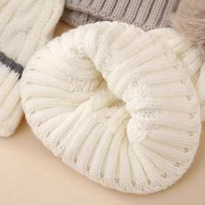 Warm winter knit beanie for baby boys in cream white with gray accents and thick texture