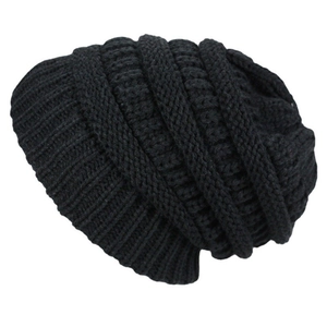 Detail of black knit beanie showing thick texture and warm winter fabric construction