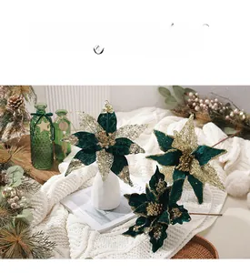 Close-up of a 30cm green velvet Christmas poinsettia with gold sequins and glitter