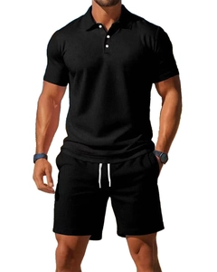Detail of black summer polo and shorts set showing breathable knit texture on male model