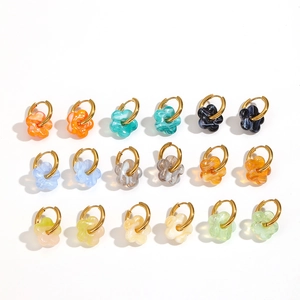 Set of 9 colorful glass flower charms on golden stainless steel hoop earrings