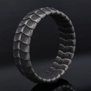 Vintage oxidized silver dragon scale pattern stainless steel ring on black background