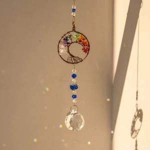 Tree of Life suncatcher with colorful chakras stones and crystal ball casting rainbow dots