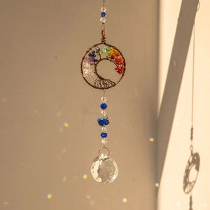 Tree of Life suncatcher with colorful chakras stones and crystal ball casting rainbow dots