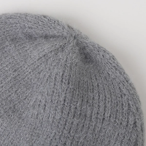 Close-up of thick ribbed knit fabric with soft brushed mohair texture in grey