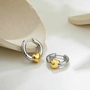 Two-tone heart hoop earrings in 18K gold and silver minimalist two-tone design