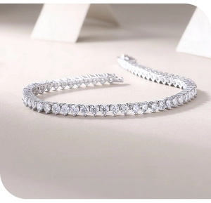 Detailed view of heart-cut moissanite tennis bracelet in 18K white gold plated silver