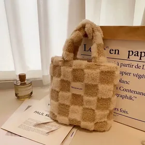 Detail of waffle fleece lamb wool tote bag with checkerboard pattern and woven label