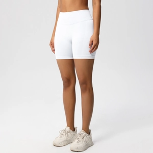 Detailed close-up of white seamless high-waisted workout shorts with scrunch butt lift effect