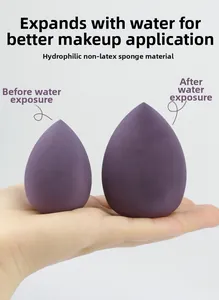 Macro view of purple makeup sponge showing size expansion after soaking in water