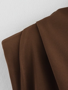 Detailed close-up of dark brown twill fabric texture showing fine fiber and weave pattern