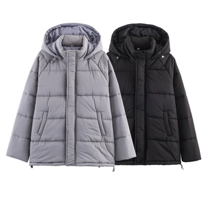 Detail view of winter hooded puffer jacket with drawstring hem and quilted texture design