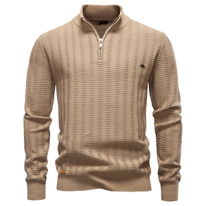 Detail of khaki men's sweater featuring a vertical stripe texture and half-zip stand collar