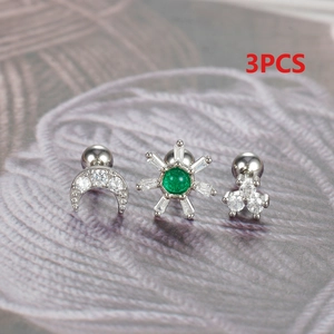 Detailed view of 3pcs silver moon and green crystal cartilage earring set