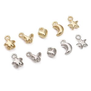 Assorted gold and silver star, heart, and moon pendants for DIY jewelry making
