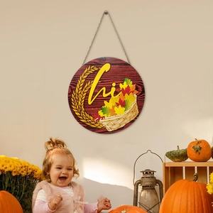 Fall themed round wooden hi door sign with autumn leaves and wheat on warm background