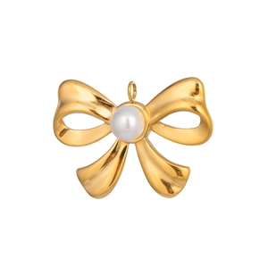 Detailed macro view of 18K gold-plated bow charm with a lustrous white pearl center