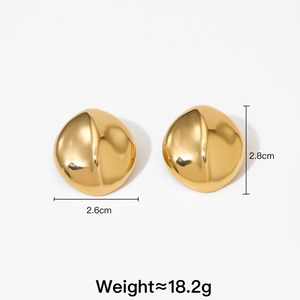 Close-up of gold geometric earrings showing 2.8cm height and 2.6cm width dimensions