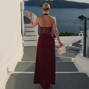 Detail of burgundy backless halter maxi dress with lace splicing and satin texture