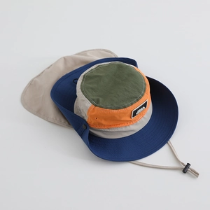Detail view of the detachable neck protection flap and wide brim on sun hat