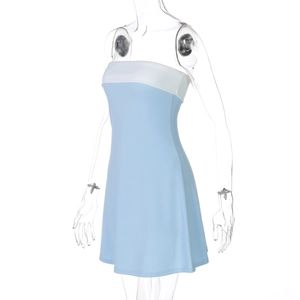 Detail view of a bodycon mini dress featuring blue and white contrast patchwork design