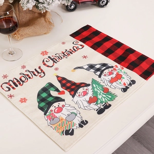 Linen Christmas placemat with gnomes and Merry Christmas text in festive home setting