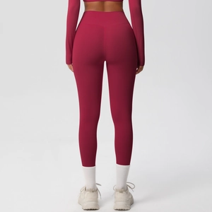 Rear view of wine red seamless high-waist yoga set showing body-shaping compression fit
