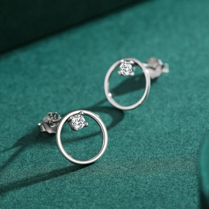 Elegant 925 silver geometric hoop earrings with sparkling cubic zirconia on dark background