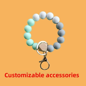 Detail of food-grade silicone beaded keychain wristlet with a hexagonal wooden bead