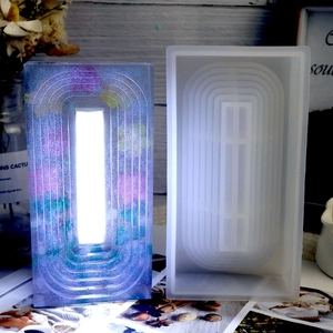 Macro shot of arch-shaped resin lamp silicone mold with dried flower night light finish