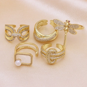 Set of four 18k gold plated adjustable rings with dragonfly, pearl and zircon details