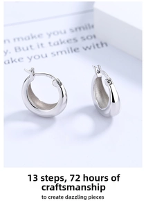 Macro shot of high polished S925 sterling silver drop earrings with smooth mirror finish