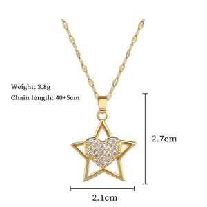 Detail view of gold star and crystal heart pendant with size and weight measurements
