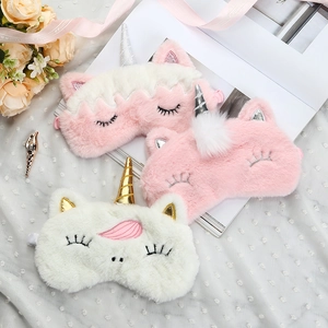 Three cute plush unicorn sleep masks with 3D horns and embroidered eyelashes on gauze