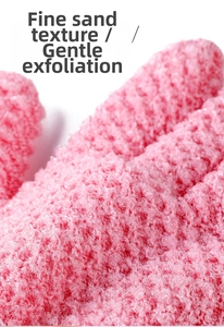 Close-up of pink exfoliating shower glove texture with fine frosted fiber surface