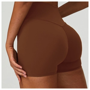 Detail of high-waisted yoga shorts in dark brown with seamless tummy control and butt lift