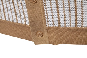 Detailed close-up of brown and white striped knit polo shirt with button placket