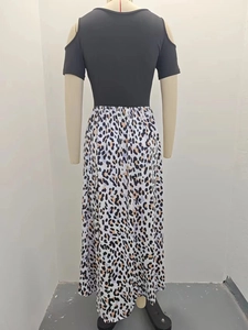 Detail of off-shoulder black bodice spliced with leopard print maxi skirt fabric