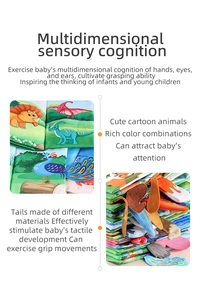 Detail of baby cloth book with textured animal tails for sensory and tactile development