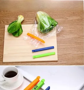 Detail of colorful plastic food sealing clips used on various snack bags for freshness