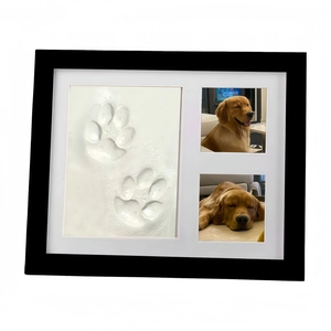 Black wooden pet memorial picture frame with clay paw print kit and dog photos