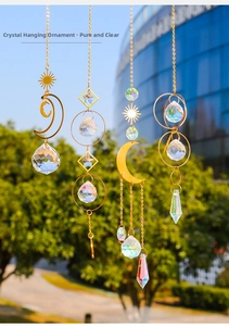 Detailed set of four gold metal suncatchers with crystal prisms in moon and star shapes