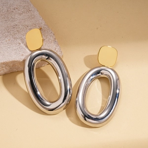 Modern geometric earrings with 18k gold square studs and polished silver oval hoops