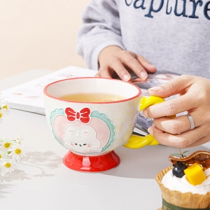 Hand-painted ceramic mug with embossed rabbit design and colorful handle for coffee or milk