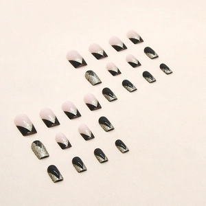 Sparkling French press-on nails in nude and black with silver glitter V-stripes