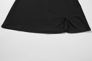 Detailed close-up of the black summer mini dress hem featuring a clean side slit design