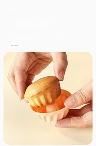 Macro shot of smooth non-stick interior of the pink silicone muffin mold for easy release