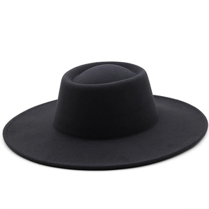Top-down view of a classic black wide-brim wool fedora hat with a flat oval crown