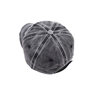 Detailed top view of washed dark grey baseball cap with white contrast stitching accents
